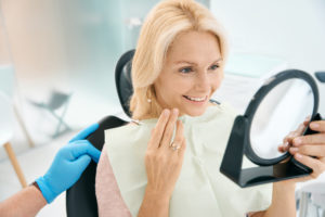 woman happy with dental work amalgam-free dentistry concept